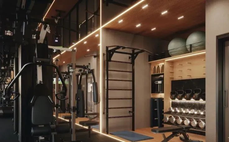 Academia do Canaã Residence com estação de musculação, espaldar, halteres e bolas de pilates