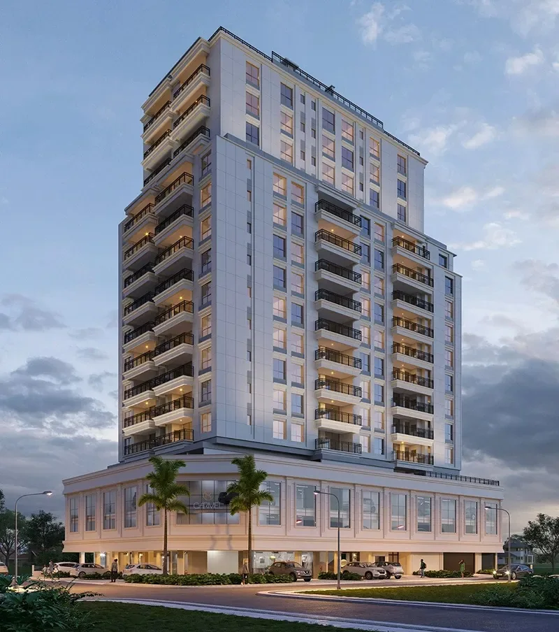 Torre do Carmel Residence em tons claros, com sacadas e embasamento comercial com palmeiras
