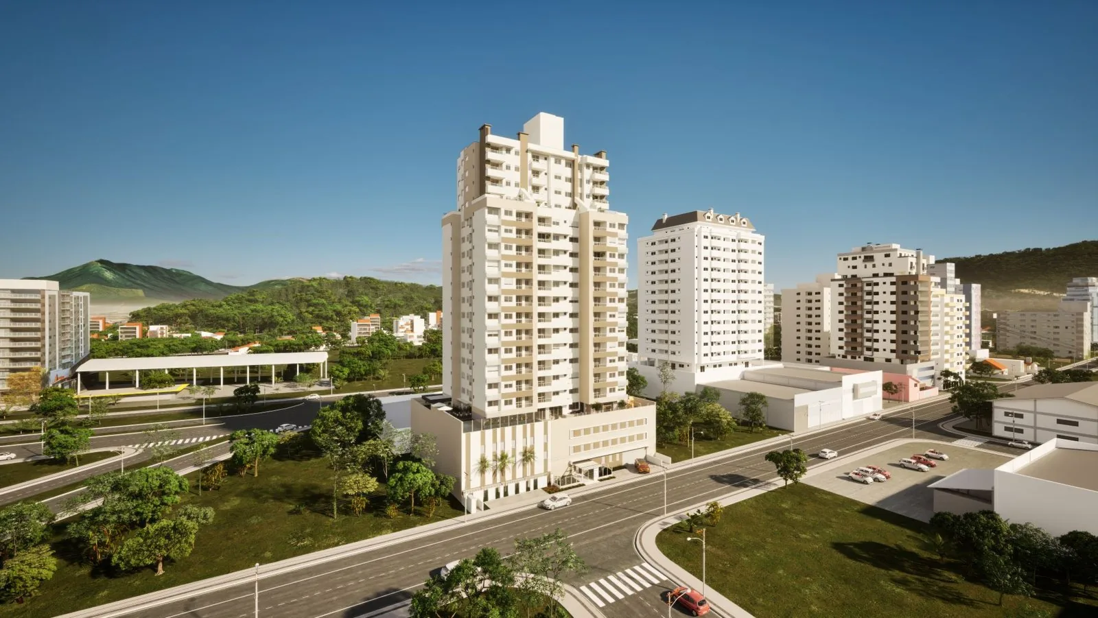 Fachada do Enjoy vista da avenida, com a rótula, o verde da Pedra Branca e o morro ao fundo