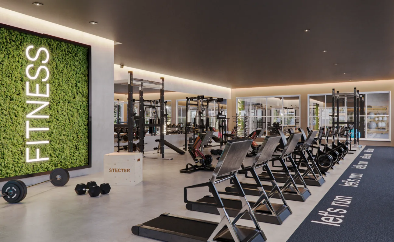 Academia climatizada do Garden Club Residence II, com esteiras, aparelhos de musculação e parede verde