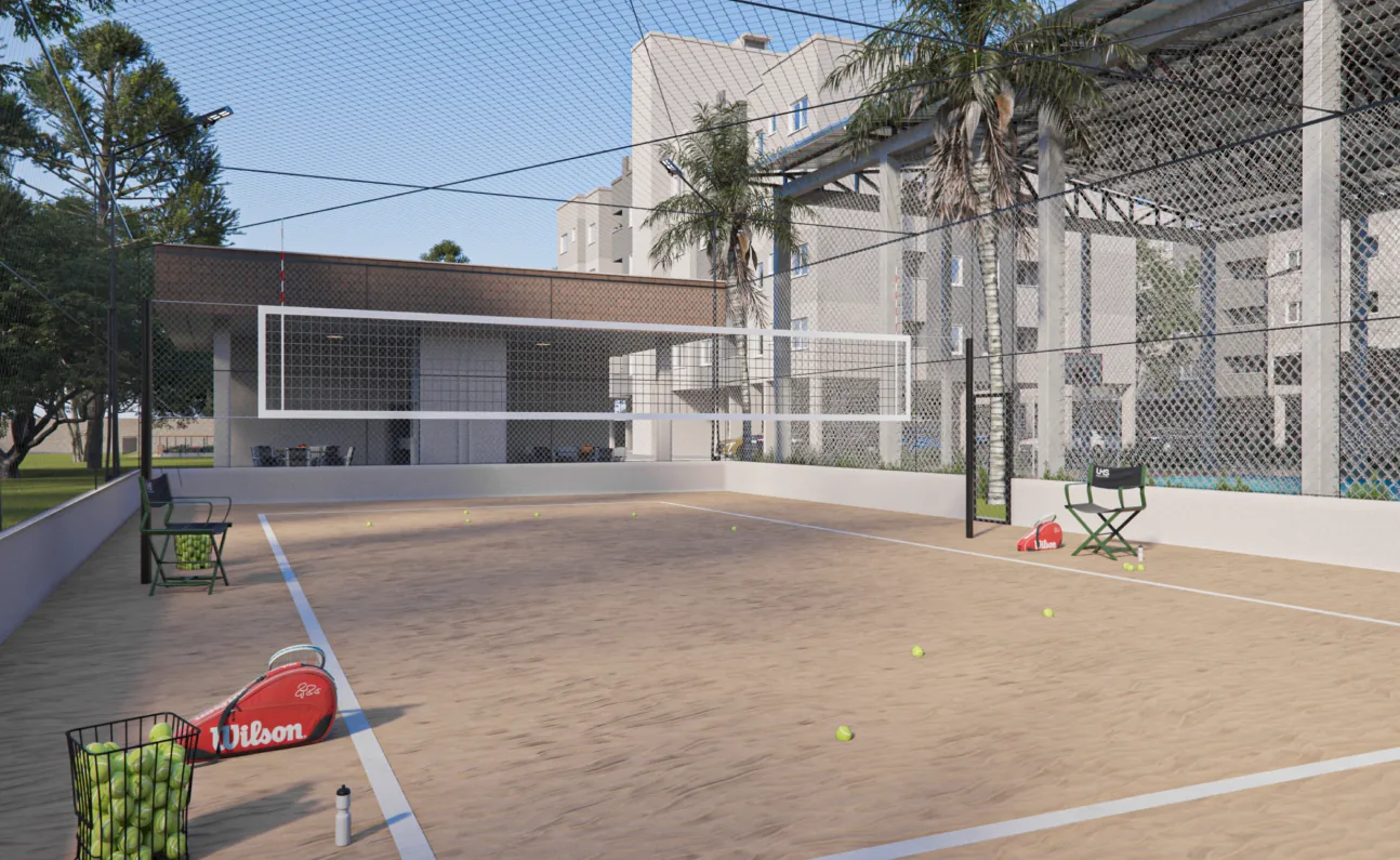 Quadra de areia do Garden Club Residence II, com rede e raquetes de beach tênis