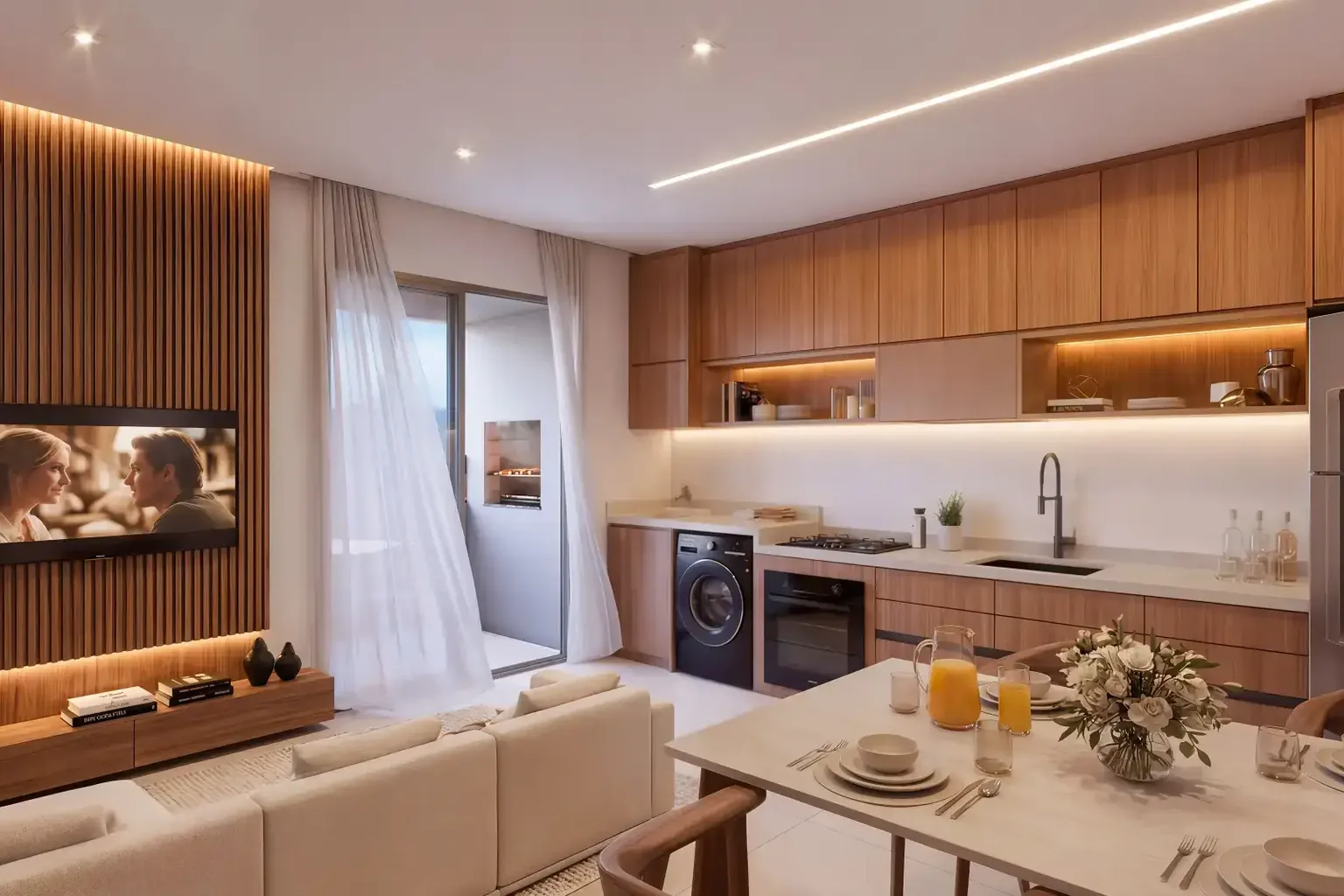 Sala e cozinha integradas do apartamento do Sinai Residence, com painel de madeira, armários planejados e mesa de jantar