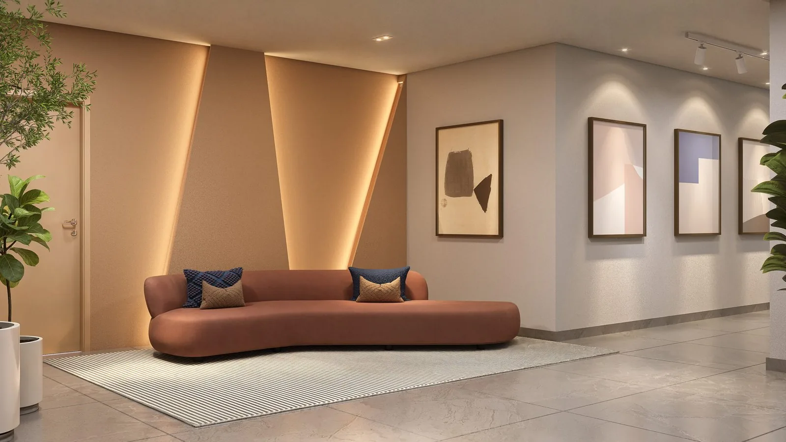 Hall de entrada do View Residence, com sofá curvo, quadros e iluminação indireta nas paredes